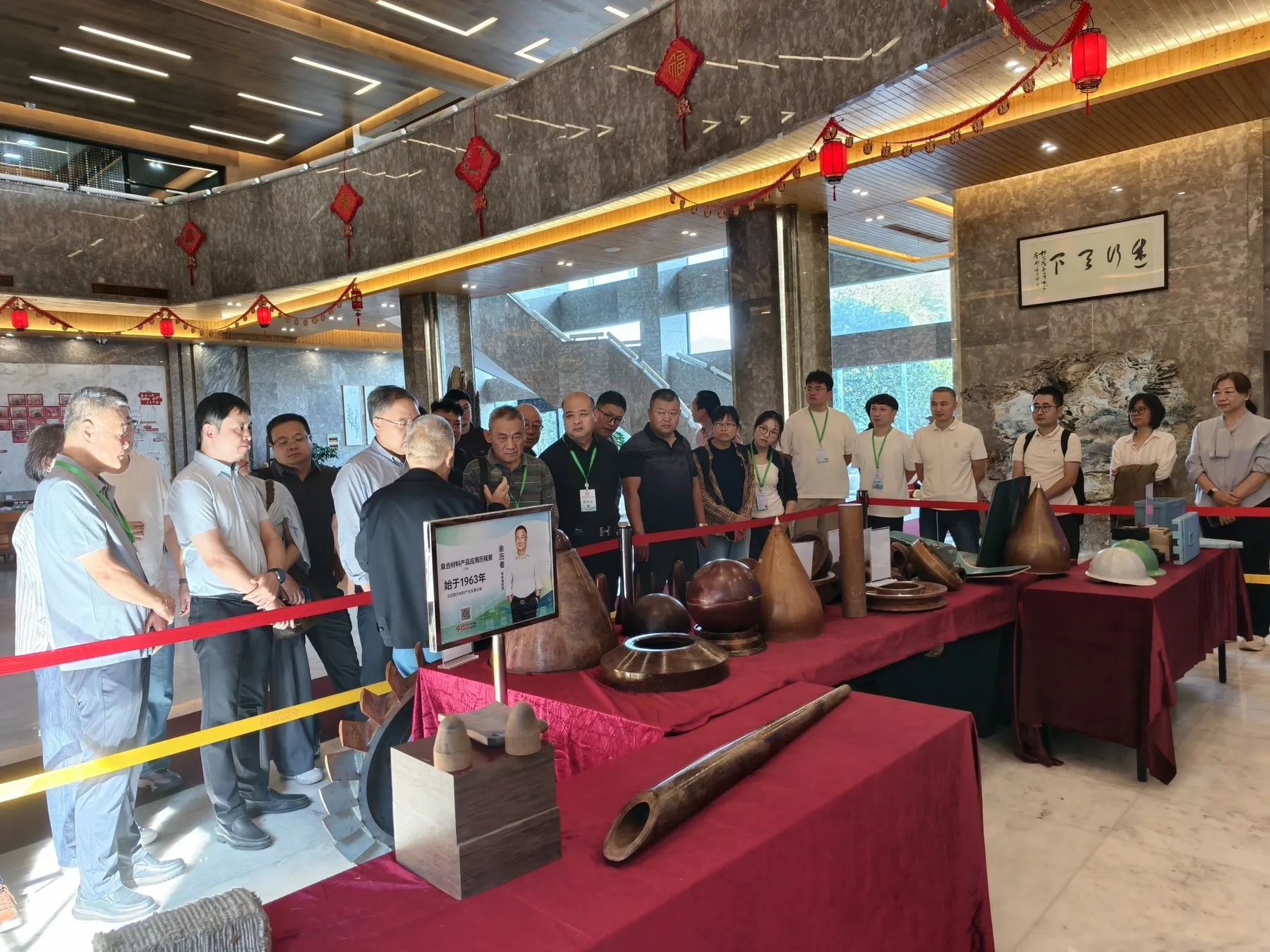 Delegates listening to Huang Jiakang at the historical GRP products display