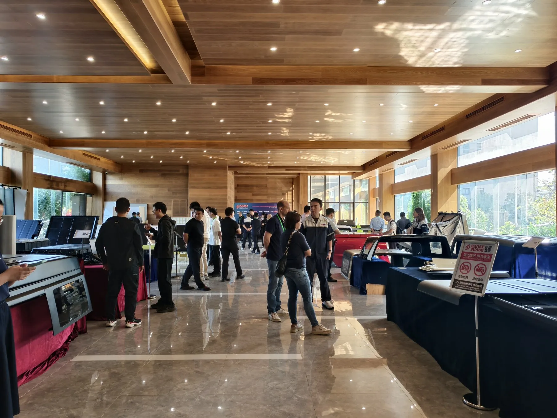 Delegates viewing composite components in SUASE’s sample display area